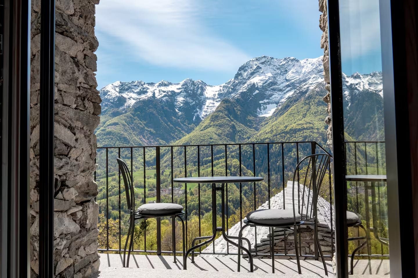 Snow-capped mountains seen from the terrace of Rustico La Pezza